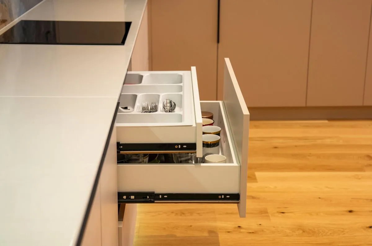 An open drawer with dividers
